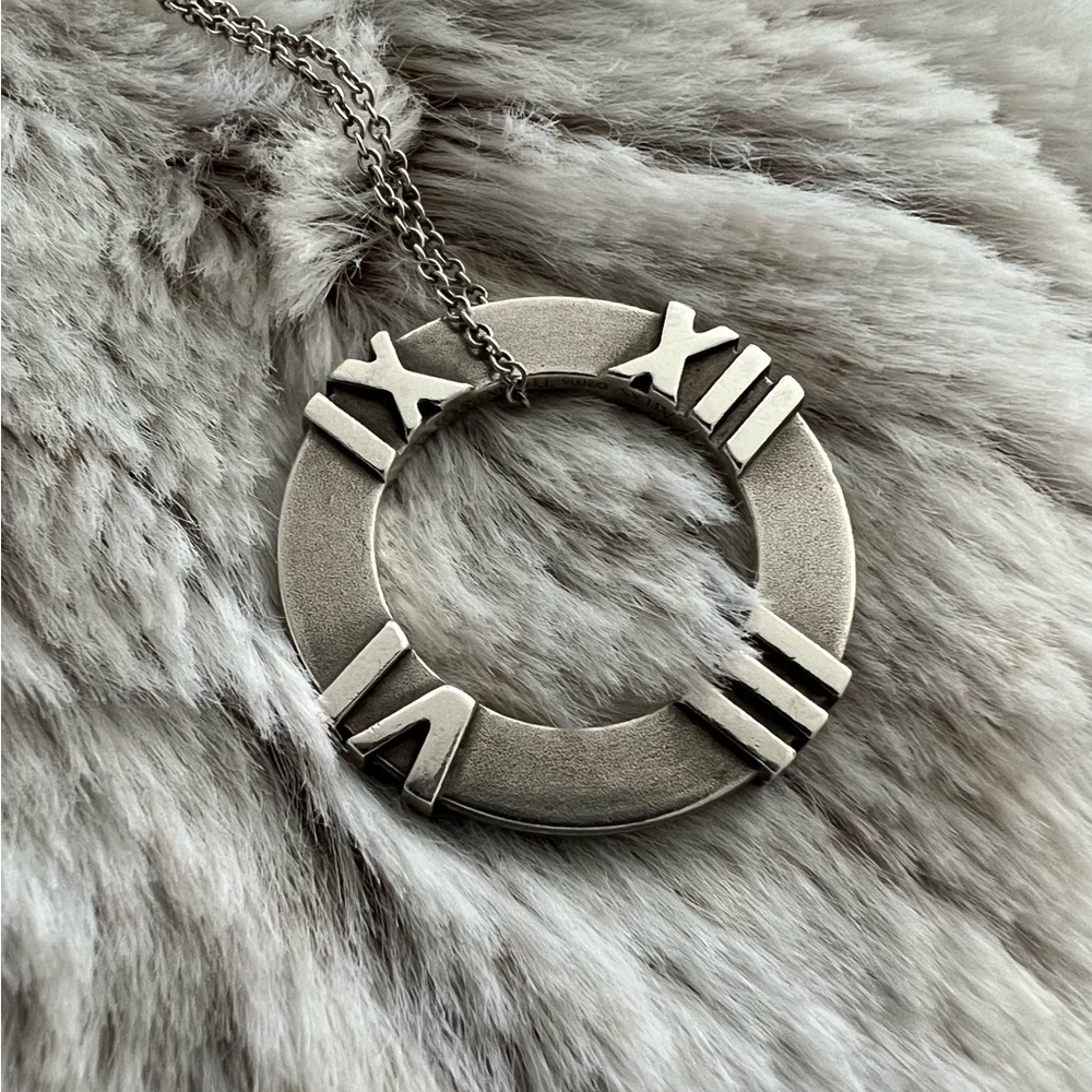 Tiffany & Co Closed Circle Matte Silver Atlas Roman Numeral Pendant Necklace